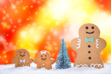 Funny gingerbread family on snow