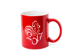 Red cup and a stylized drawing of a rooster. Isolated on white