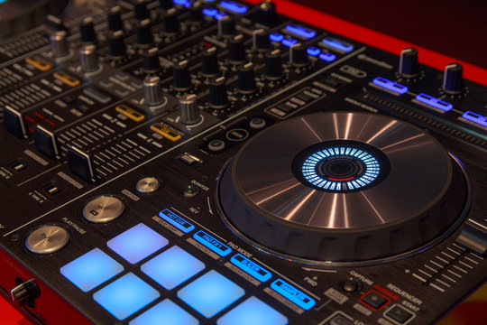 DJ player and mixer in nightclub. Music