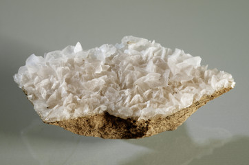 Calcite white crystal formation over a rock substrate