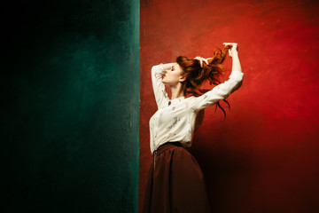 Beauty woman on a colored background. Woman surprised
