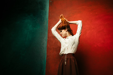 Obraz premium Beauty woman on a colored background. Woman surprised