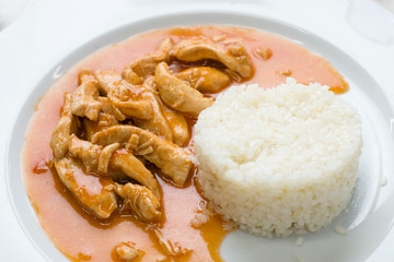 Chicken meat with sauce and rice