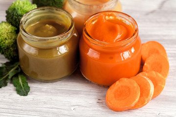 baby vegetable puree on wooden background