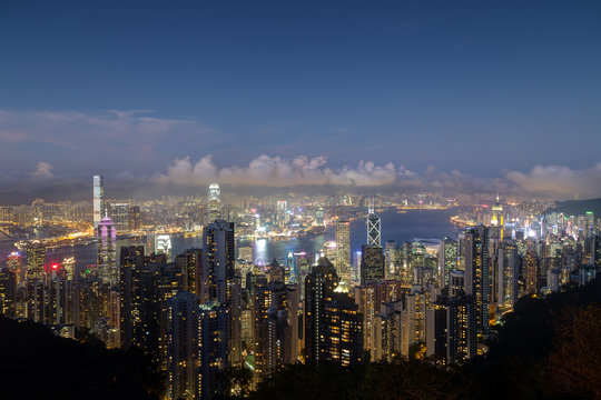 Hong Kong's famous skyline viewed from the Victoria Peak in the evening. Copy space.