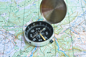 Fototapeta na wymiar Symbols of travel - map with compass.