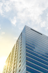 Fototapeta na wymiar Glass building with blue sky