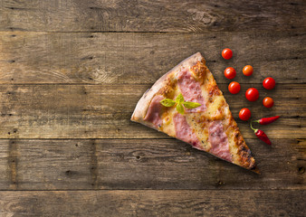Diferents types of pizza cut on wooden table