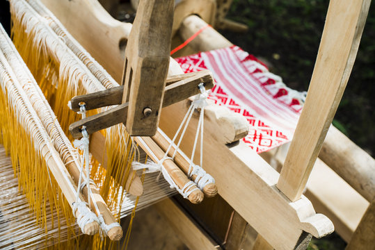 Weaving on a wooden loom