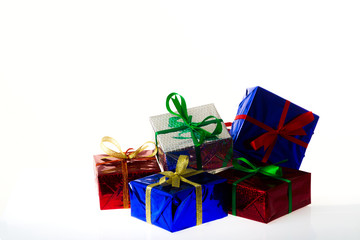Multi-colored gift boxes on white background