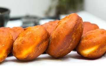 Donuts frying in deep fat
