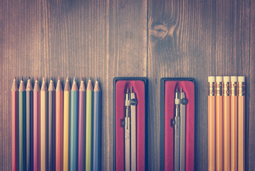 Overhead view on neatly arranged pencils and calipers