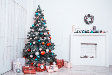 Beautiful new year room with decorated Christmas tree, gifts and fireplace. The idea for postcards....