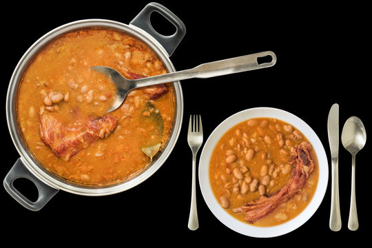 Baked Beans With Smoked Pork Ribs Dinner Served Isolated On Black Background