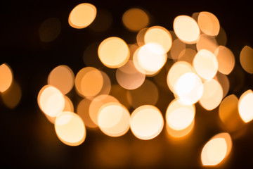 Fototapeta premium Defocused gold abstract Christmas Glitter Lights bokeh Background