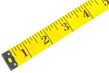 Yellow measure tape on white background