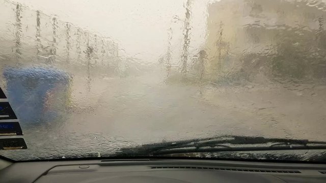 Driving in the city in extreme nature conditions of rain and hail.