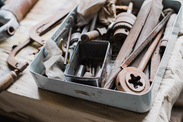 still life tool box with nails rasp and old tools