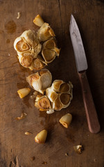 Roast Garlic on Rustic Wood Cutting Board