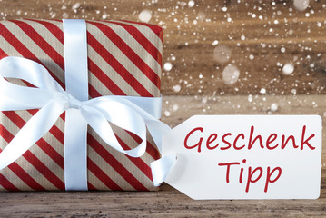 Fototapeta na wymiar Present With Snowflakes, Text Geschenk Tipp Means Gift Tip