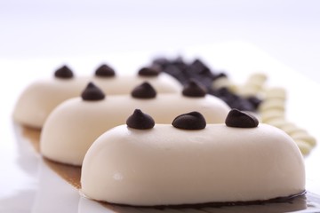 Fototapeta na wymiar Creamy ice cream with chocolate on a white plate