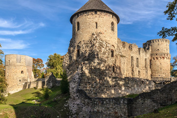 Fototapeta na wymiar Watchtower and surrounding wall of castle ruins in Cesis town, Latvia