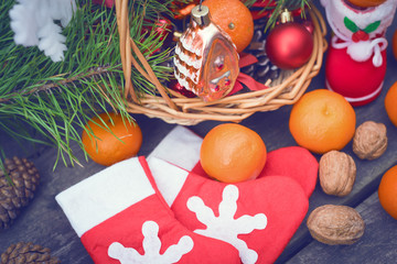 Branches of a Christmas tree on old boards. Christmas background. Christmas Socks. Christmas decorations. New Year background. Xmax background. Toned image.