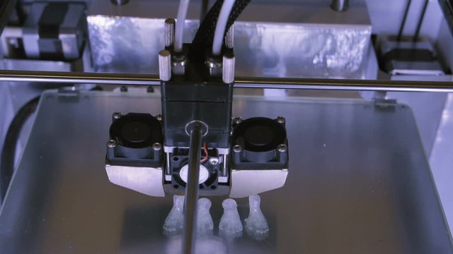 Three dimensional printer during work in laboratory, 3D plastic printer, 3D printing