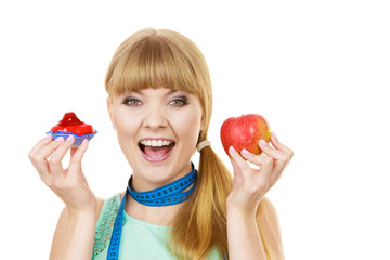 Woman choosing fruit or cake make dietary choice