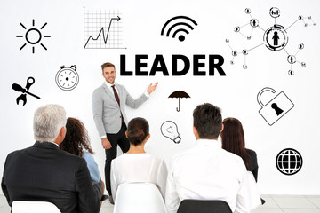Business conference. Business coaching and development concept. Word LEADER on background.