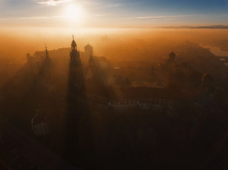 Fototapeta Aerial view of Wawel castle at sunrise in the mystic fog obraz