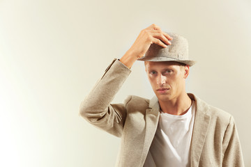 Portrait of stylish man on light background