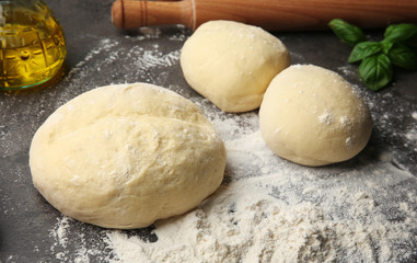 Preparation homemade pizza on kitchen table