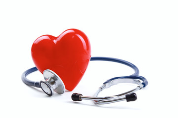Red heart and a stethoscope on desk