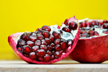 fresh pomegranate on a yellow background