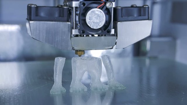 3D printer print the human like monkey using plastic filament