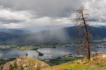 Clouds rolling over the town and lake Osoyoos, Southern British Columbia, Canada