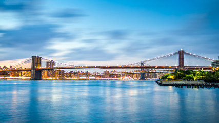 Brooklyn Bridge and Manhattan skyline at dusk on Pier2 park in New Yok City