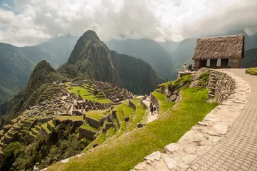 Photo sur Plexiglas Machu Picchu The ancient city of Machu Picchu, Peru. Overlooking ruins on the Inca citadel in the Andes Mountains and the river valley below.