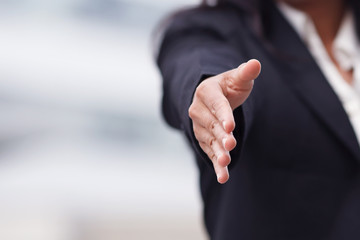 Fototapeta premium Business woman giving a handshake.