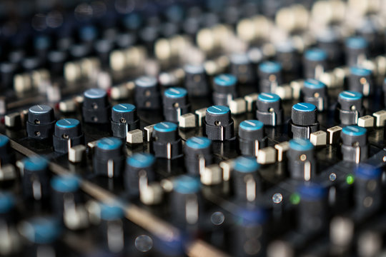 Vintage Sound Or Audio Mixer In A Recording Studio. Knobs, Dials And Sliders On A Soundboard.