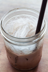 Iced coffee on wooden table