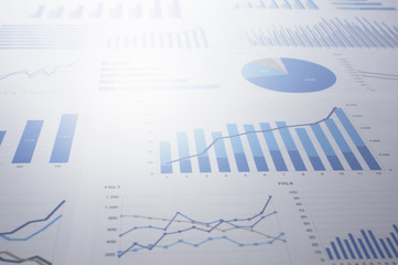 Flood of data. Many charts and graphs. Reflection light and flare.
Concept image of data gathering and statistical working.
