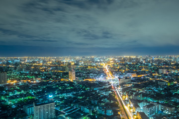 Fototapeta na wymiar Bangkok at Night, City scape view on metropolis of Thailand and Cloudy blue sky