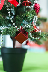 Christmas tree closeup with red decoration elegant hanging | celebration festivity xmas | home object vintage