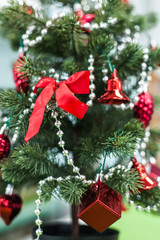 Obraz na płótnie Canvas Christmas tree closeup with red decoration elegant hanging | celebration festivity xmas | home object vintage