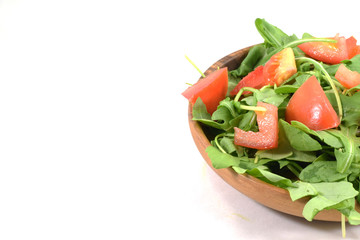 Fresh tomato chunks with organic arugula