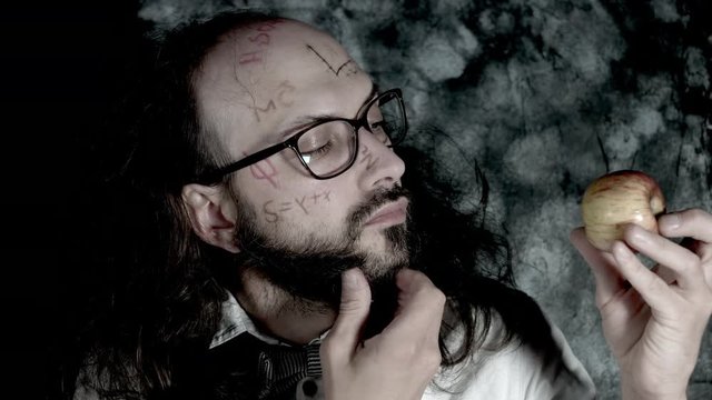 4k Crazy Professor Science Man Looking at Apple and Thinking