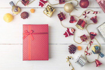 Christmas and Happy new year present box decoration flat lay on white wooden background with vintage filter.