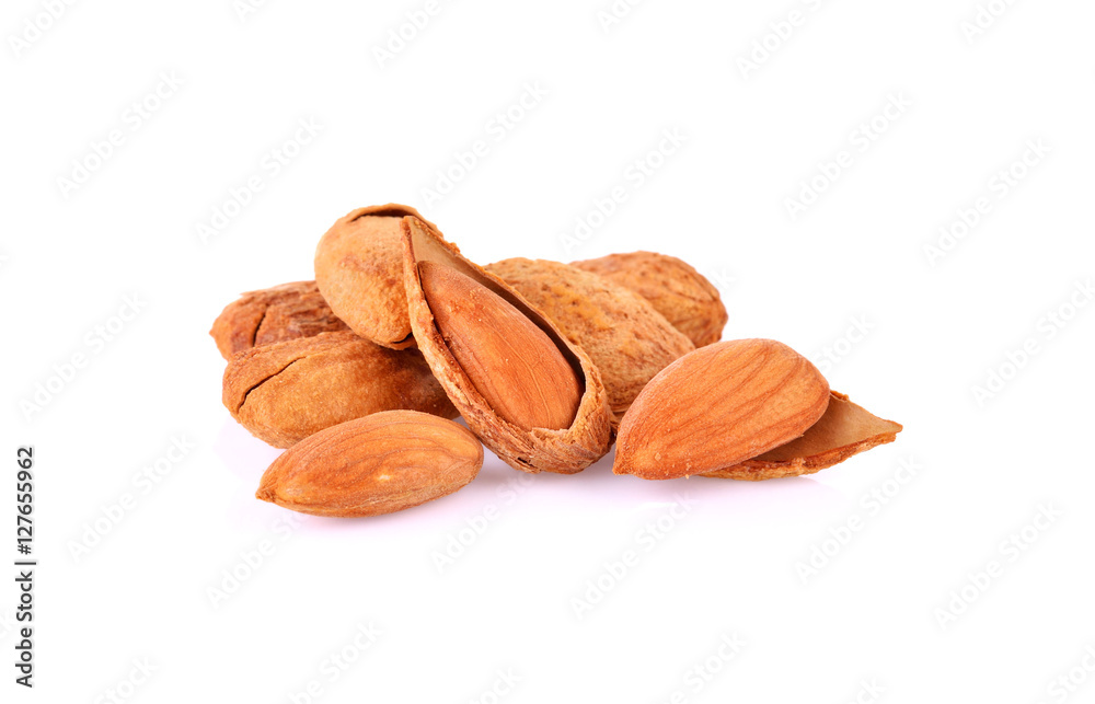 Wall mural dried almonds isolated on a white background